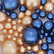 Assorted navy blue and gold pearl bead vase fillers on white background - thumbnail number 1