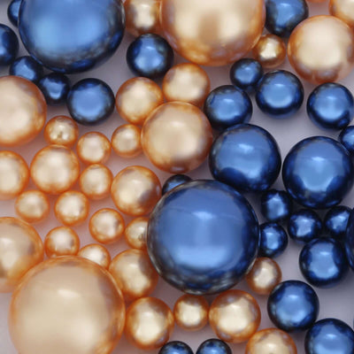Assorted navy blue and gold pearl bead vase fillers on white background - thumbnail number 1