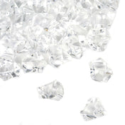 Pile of clear faceted acrylic ice crystals for vase fillers on a white background - thumbnail number 1