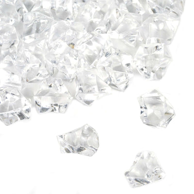 Pile of clear faceted acrylic ice crystals for vase fillers on a white background - thumbnail number 1