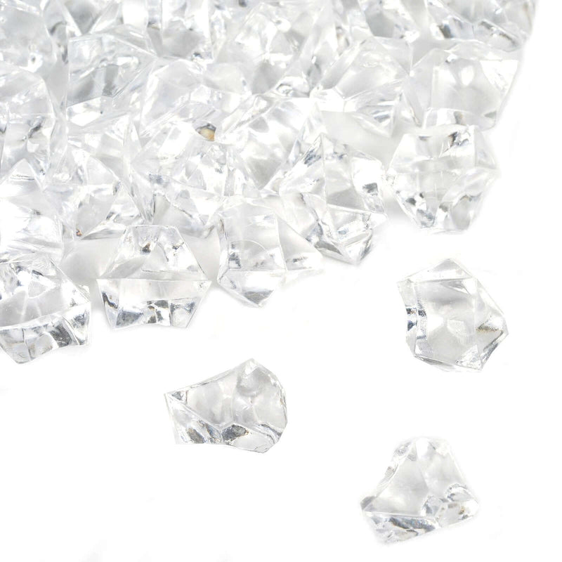Pile of clear faceted acrylic ice crystals for vase fillers on a white background - thumbnail number 1