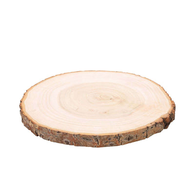 Natural round wood slice with bark edge for rustic table decor on a white background - thumbnail number 1