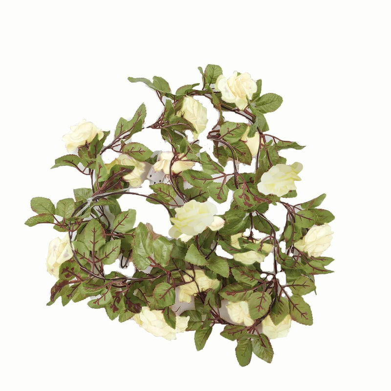 White silk rose garland with green leaves and vine lights on a white background - thumbnail number 1