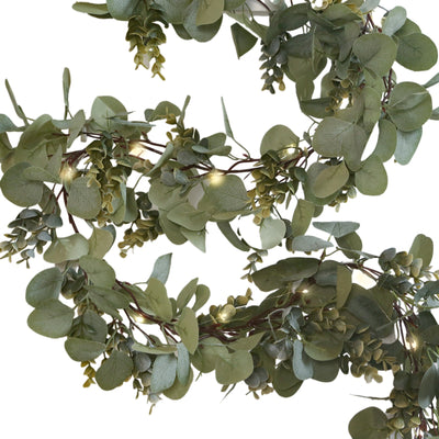 Faux greenery eucalyptus garland with warm LED lights on a white background - thumbnail number 1