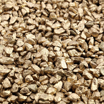 Polished metallic gold decorative stones close-up on white background - thumbnail number 1