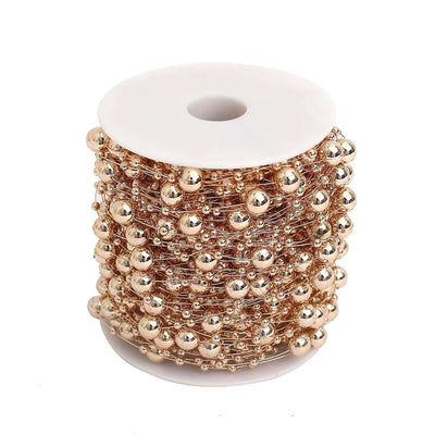 Rose gold faux pearl string beads vase filler spool on white background - thumbnail number 1