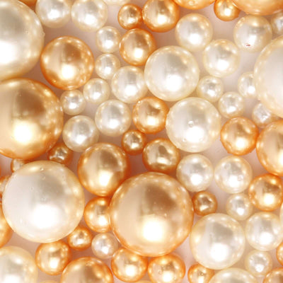 Assorted off white and gold pearl beads vase fillers on white background - thumbnail number 1